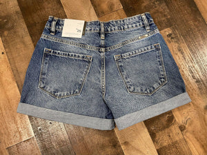 Strut your stuff this summer in our Summer Time Fine Shorts! They are a medium wash denim short with rolled bottoms. These shorts are the perfect blend of traditional and trendy. Tuck a cute graphic tee in to these throw on some turquoise jewelry and take on a country concert. 