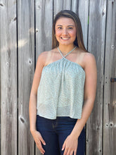 Load image into Gallery viewer, Our Star Light Top is perfect for spring and summer. She is a beautiful sage green semi-cropped halter top with mini stars printed all over her. 
