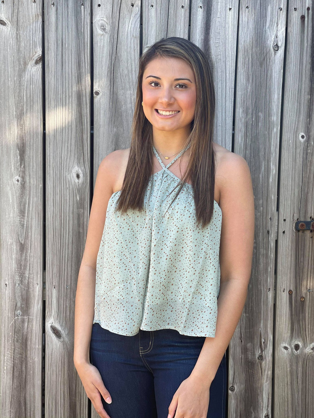 Our Star Light Top is perfect for spring and summer. She is a beautiful sage green semi-cropped halter top with mini stars printed all over her. 