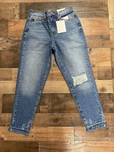 Load image into Gallery viewer, Who doesn&#39;t love a great pair of statement jeans? You are going to love our Set in Her Ways Kan Can jeans. They are a medium wash mom fit with distressing on the knee and frayed bottoms. The thing that really sets her apart from our other jeans is the rainbow threading mixed with the original white threading. You are going to love these jeans, Scoop them up today! 
