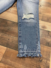 Load image into Gallery viewer, Who doesn&#39;t love a great pair of statement jeans? You are going to love our Set in Her Ways Kan Can jeans. They are a medium wash mom fit with distressing on the knee and frayed bottoms. The thing that really sets her apart from our other jeans is the rainbow threading mixed with the original white threading. You are going to love these jeans, Scoop them up today! 
