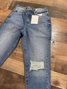 Who doesn't love a great pair of statement jeans? You are going to love our Set in Her Ways Kan Can jeans. They are a medium wash mom fit with distressing on the knee and frayed bottoms. The thing that really sets her apart from our other jeans is the rainbow threading mixed with the original white threading. You are going to love these jeans, Scoop them up today! 