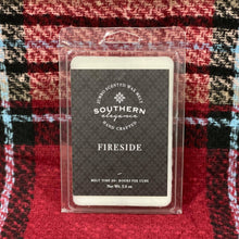 Load image into Gallery viewer, Our Fireside Wax Melt Bar is not your average wax melt bar. She is a HUGE wax melt bar, with each cube having a burn time of 20+ hours. She has 5.5 oz. of wax and is divided into 6 large cubes. She has the scent of smoke and wood blended with clove, amber, sandalwood, and patchouli. She is made from a premium soy blend and is hand poured in Raeford, North Carolina.   Due to the large size of the cubes, it is recommended to start with one cube in your warmer.
