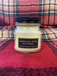 Did you know the Pine Tree is the official state tree of North Carolina? Our Carolina Pine Mason Jar Candle is a 8 oz hand poured soy candle made in Raeford, North Carolina and has a burn time of 55 hours. She has the scent of a brisk morning with pine trees swaying in the wind. The scent is reminiscent of a fresh cut Christmas tree.